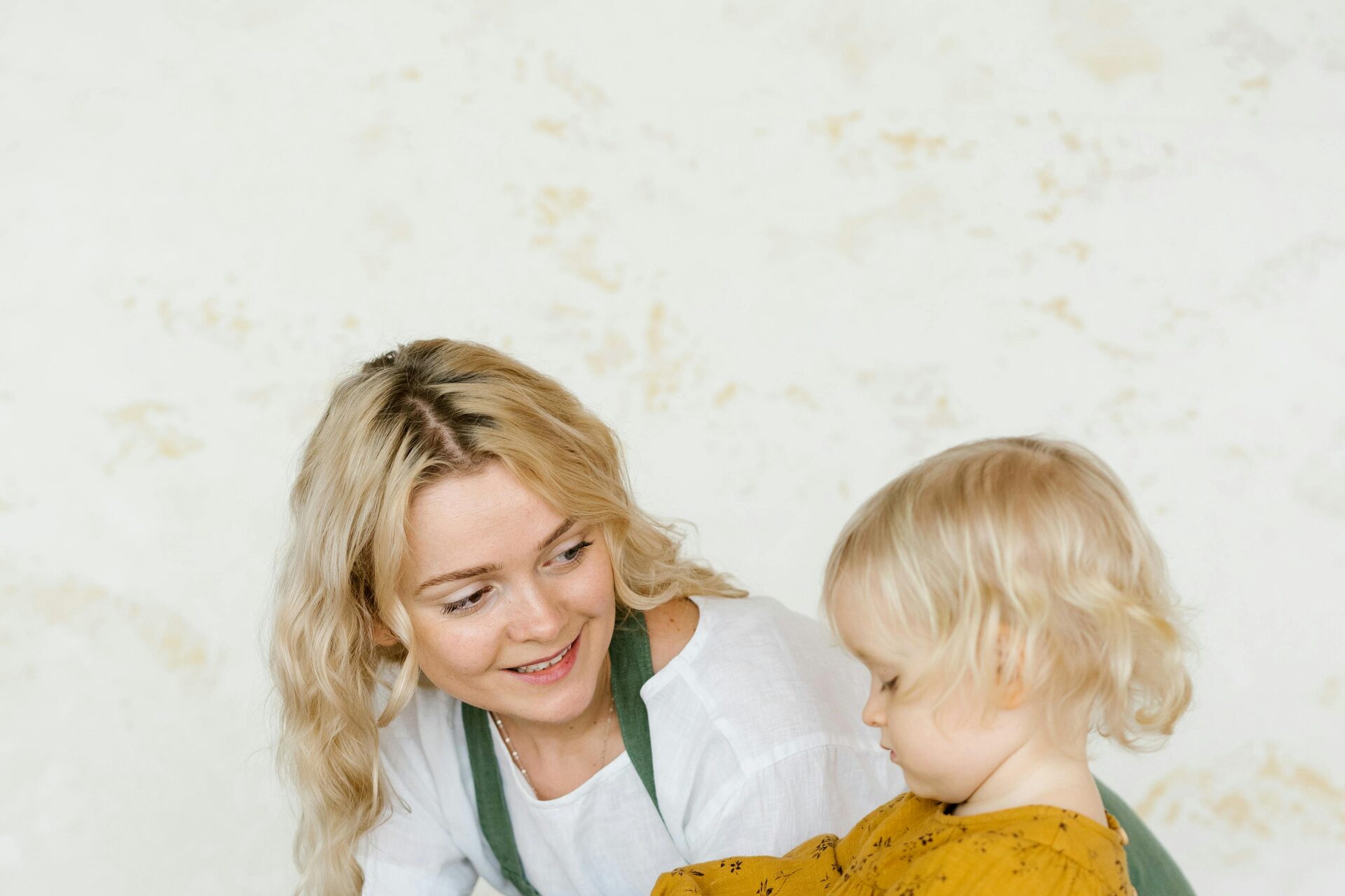 Live-in nanny caring for child at home