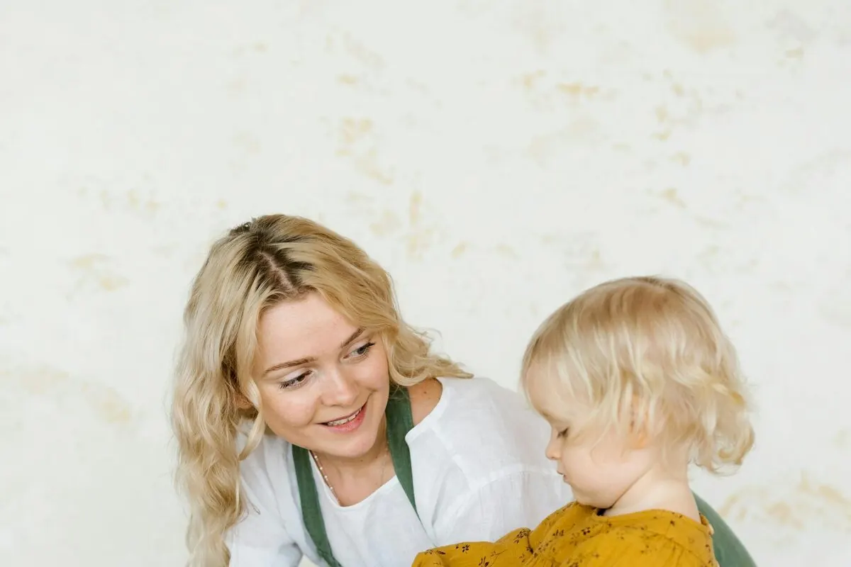 Live-in nanny caring for child at home